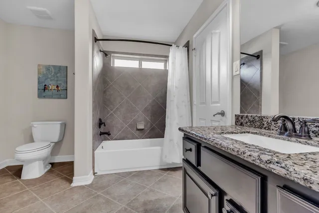 a bedroom with furniture and a book shelf