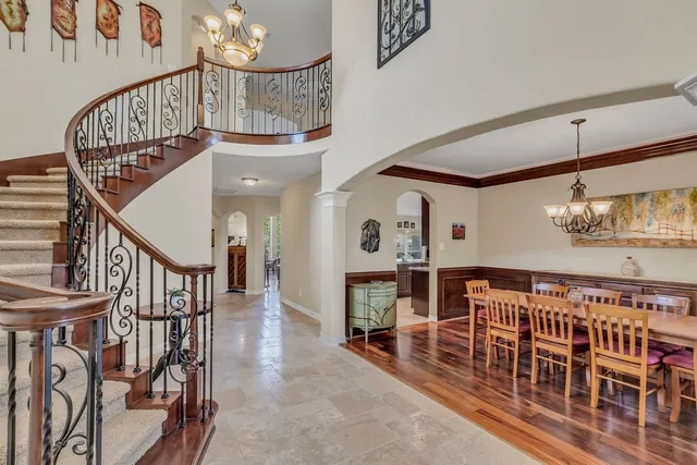 a view of entryway livingroom and hall with wooden floor