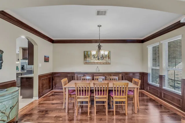 a bedroom with furniture and wooden floor