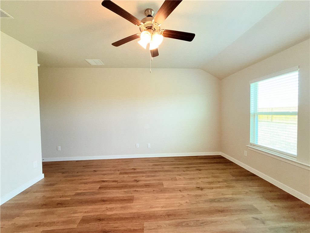 1116 Zeus Portland, TX 78374 - Photo 16 of 39 an empty room with a window and a ceiling fan