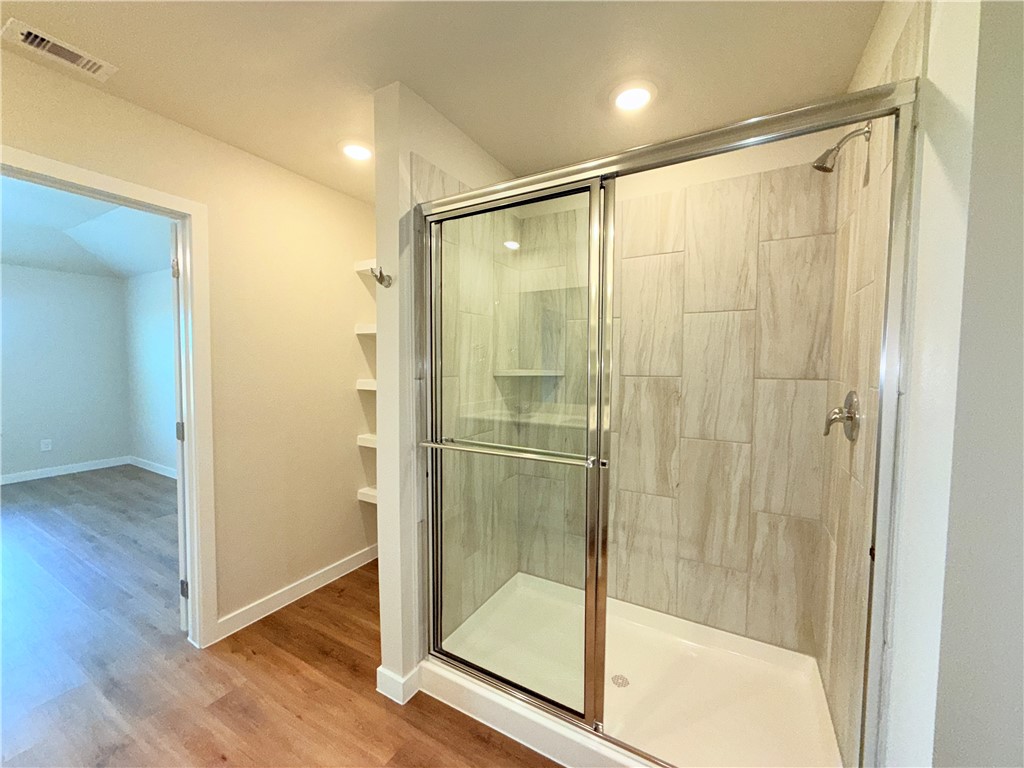 1116 Zeus Portland, TX 78374 - Photo 19 of 39 a bathroom with a glass shower door