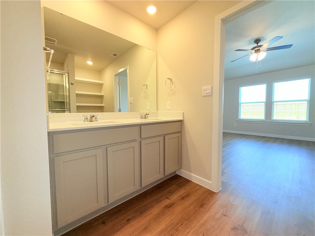 1116 Zeus Portland, TX 78374 - Photo 20 of 39 a bathroom with a sink mirror and a shower