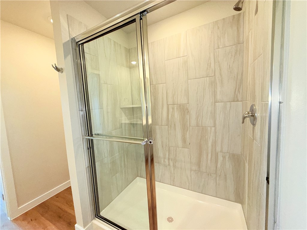 1116 Zeus Portland, TX 78374 - Photo 21 of 39 a bathroom with a glass shower door