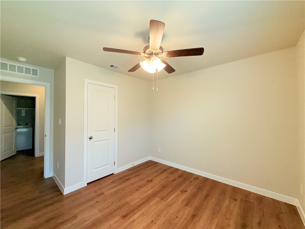 1116 Zeus Portland, TX 78374 - Photo 24 of 39 a view of a room with wooden floor and a ceiling fan