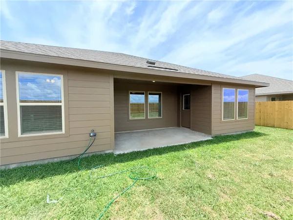 a view of house with backyard space