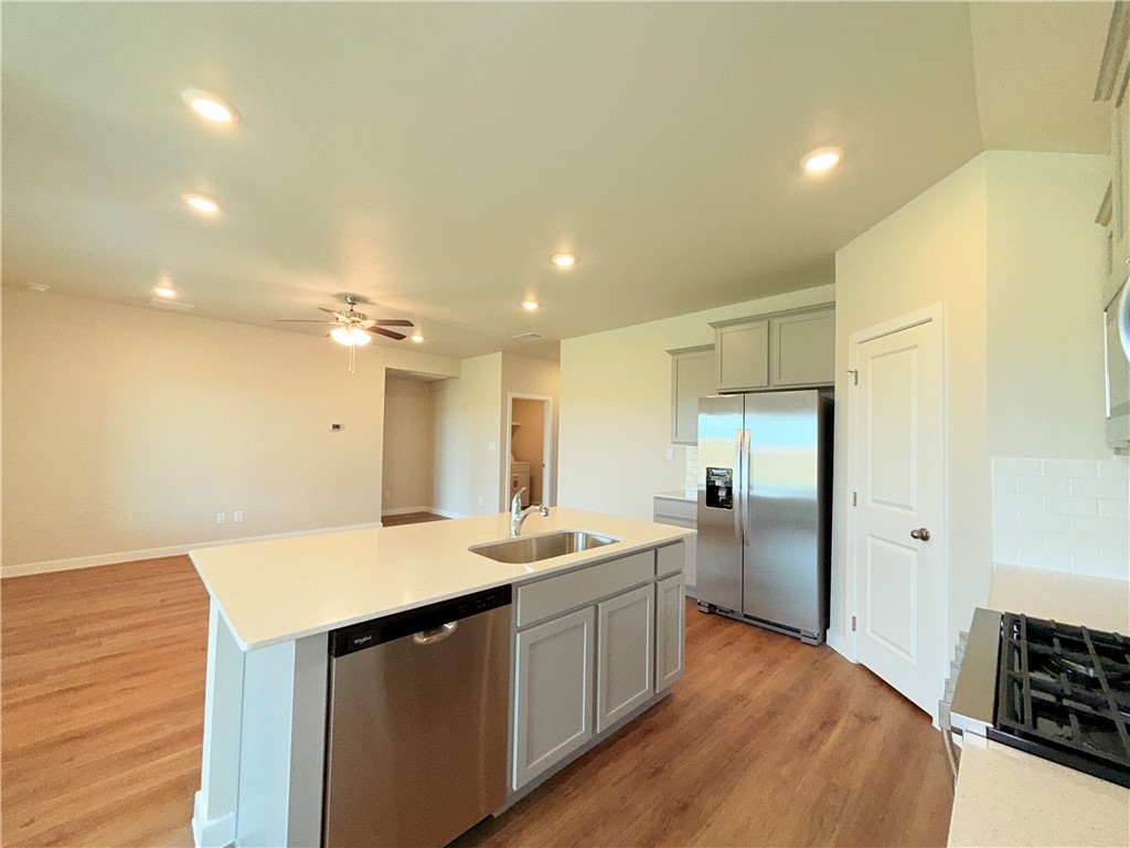 1116 Zeus Portland, TX 78374 - Photo 7 of 39 a kitchen with a sink appliances and cabinets