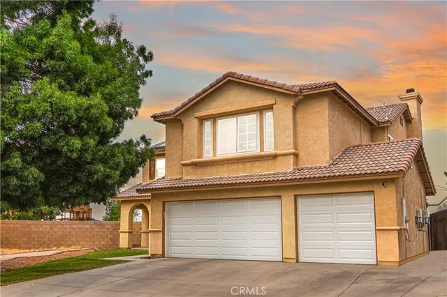 a front view of a house with a garage