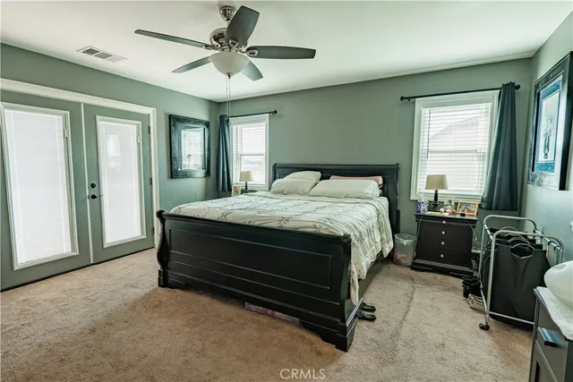 a bed sitting in a room next to a window