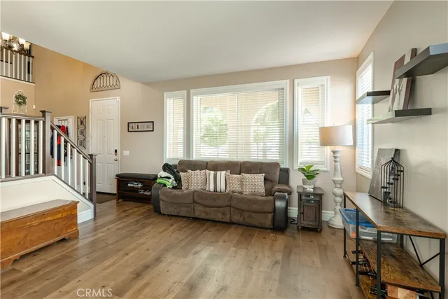 a living room with furniture window and a flat screen tv