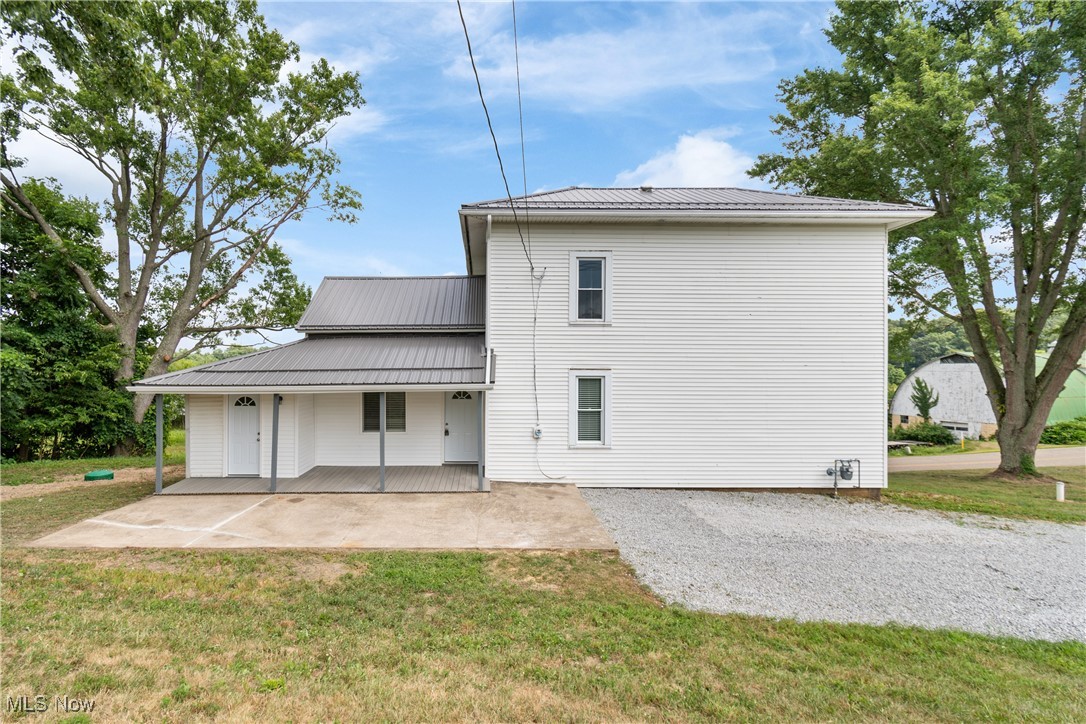 3516 Bair Road Northwest Dover, OH 44622 - Photo 5 of 29 Back view of home with covered rear porch area