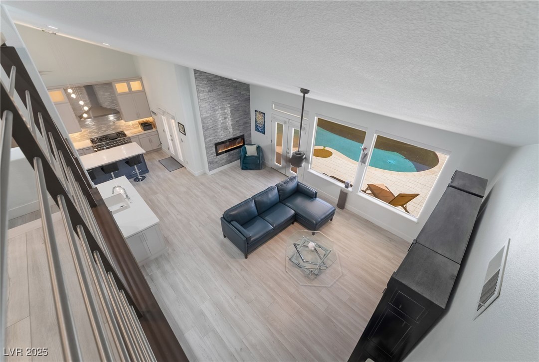 188 Carthage Street Henderson, NV 89074 - Photo 11 of 56 Living area featuring light wood-style flooring, a