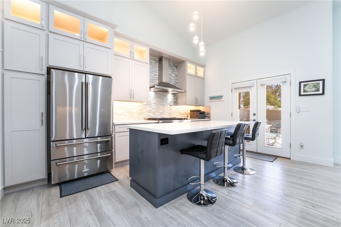 188 Carthage Street Henderson, NV 89074 - Photo 15 of 56 Kitchen featuring high end fridge, wall chimney ex