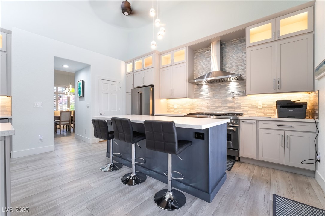 188 Carthage Street Henderson, NV 89074 - Photo 16 of 56 Kitchen featuring wall chimney range hood, high en