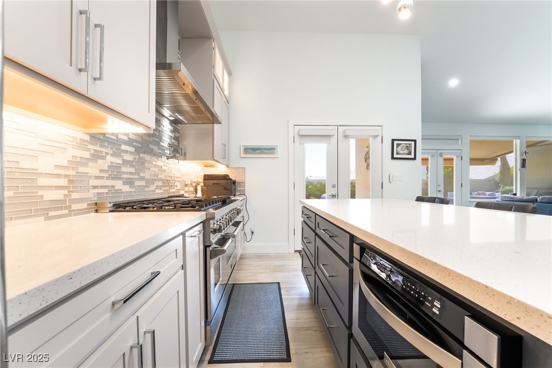 188 Carthage Street Henderson, NV 89074 - Photo 17 of 56 Kitchen featuring wall chimney exhaust hood, stain