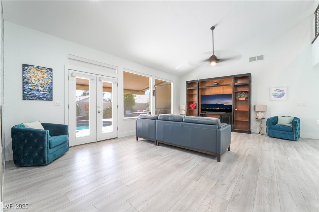188 Carthage Street Henderson, NV 89074 - Photo 20 of 56 Living area featuring ceiling fan, light wood fini