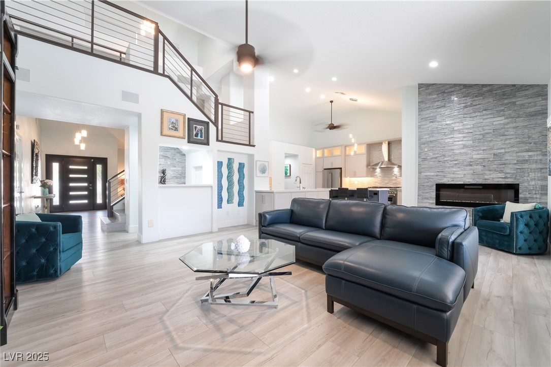 188 Carthage Street Henderson, NV 89074 - Photo 21 of 56 Living area featuring ceiling fan, a fireplace, hi