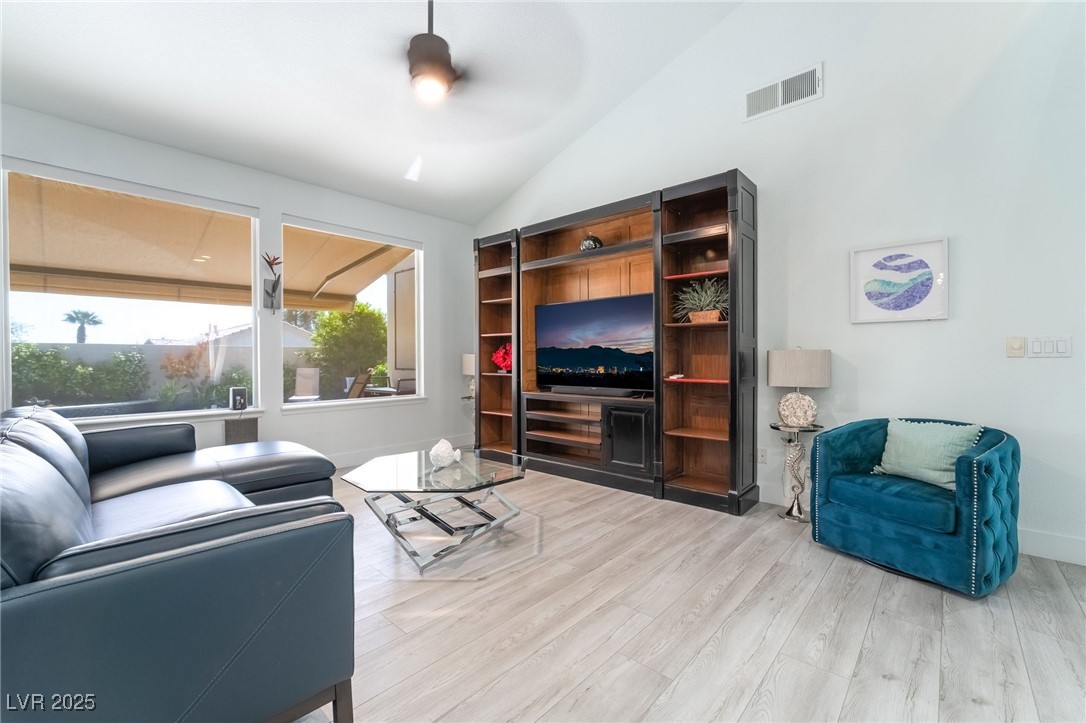 188 Carthage Street Henderson, NV 89074 - Photo 25 of 56 Living area with lofted ceiling, light wood-type f