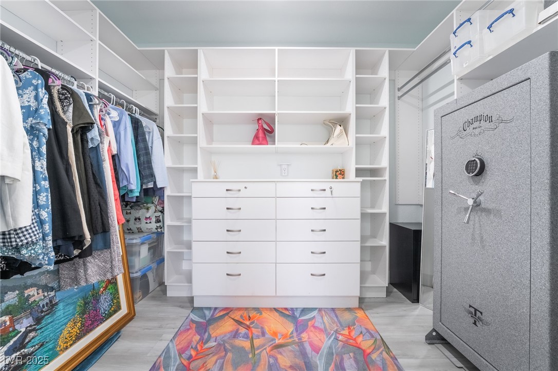 188 Carthage Street Henderson, NV 89074 - Photo 34 of 56 His and Hers Walk in closet with light wood finish