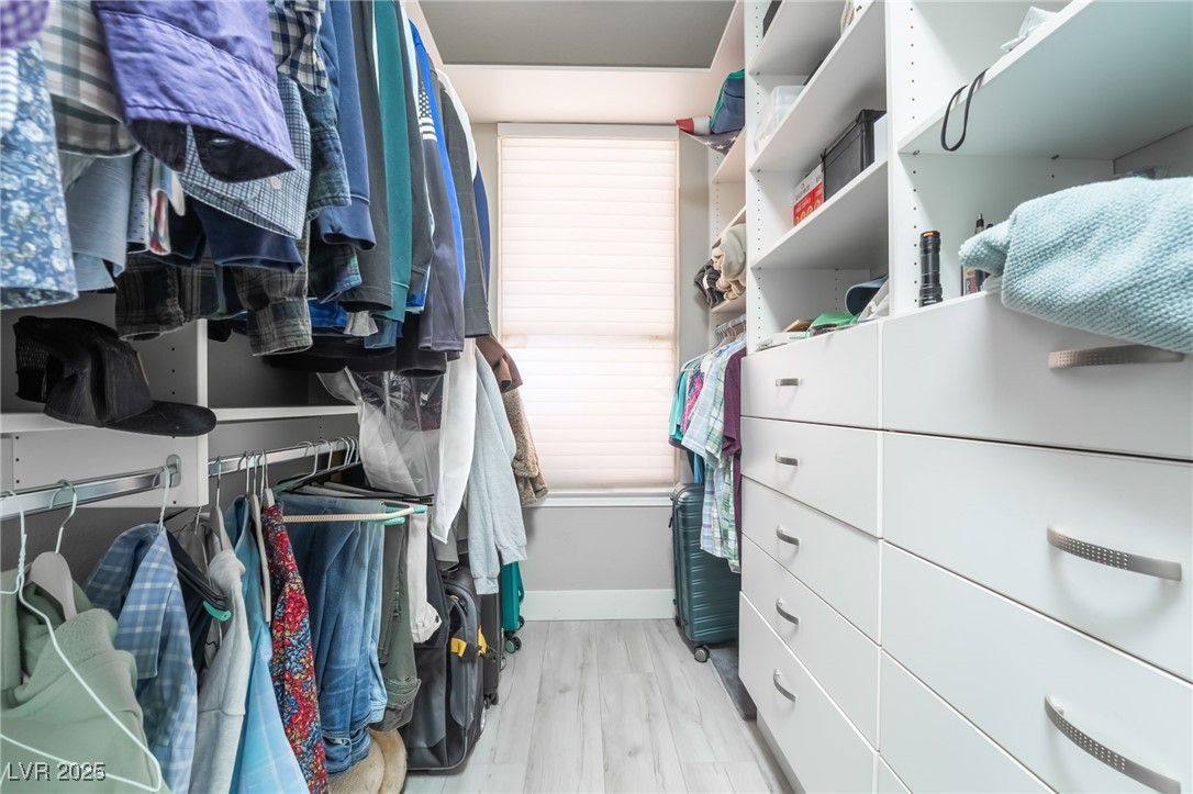 188 Carthage Street Henderson, NV 89074 - Photo 35 of 56 Spacious His and hers closet featuring wood finis