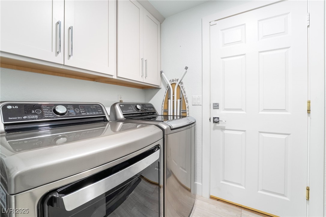 188 Carthage Street Henderson, NV 89074 - Photo 37 of 56 Laundry room featuring washer and dryer and cabine