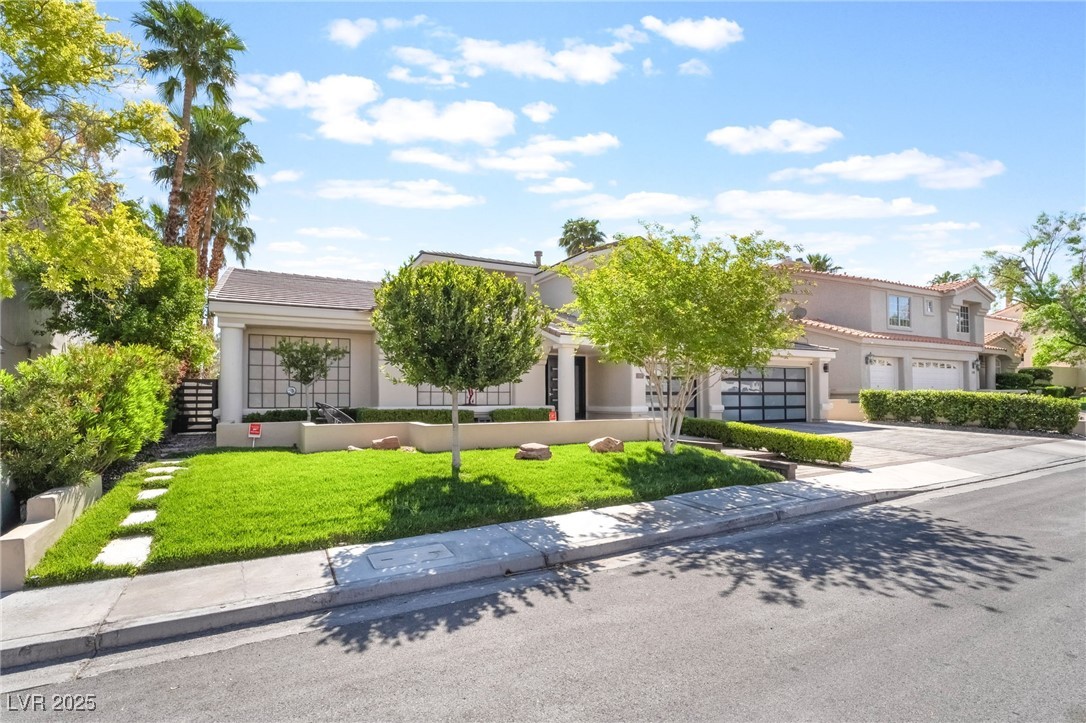188 Carthage Street Henderson, NV 89074 - Photo 4 of 56 Obstructed view of property featuring driveway, st