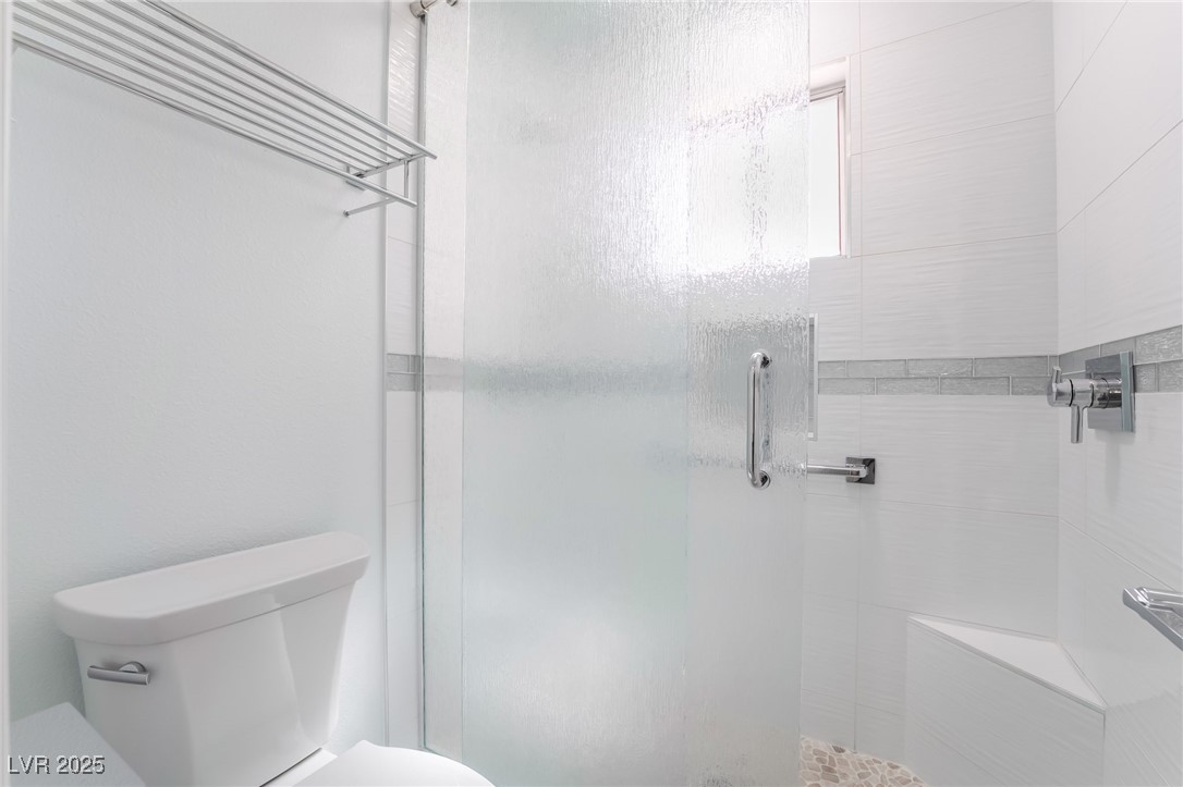 188 Carthage Street Henderson, NV 89074 - Photo 41 of 56 Bathroom featuring toilet and a shower stall