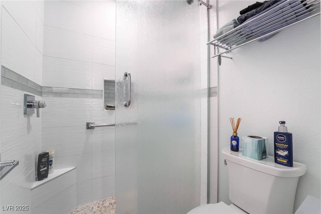 188 Carthage Street Henderson, NV 89074 - Photo 45 of 56 Bathroom with toilet and a shower stall