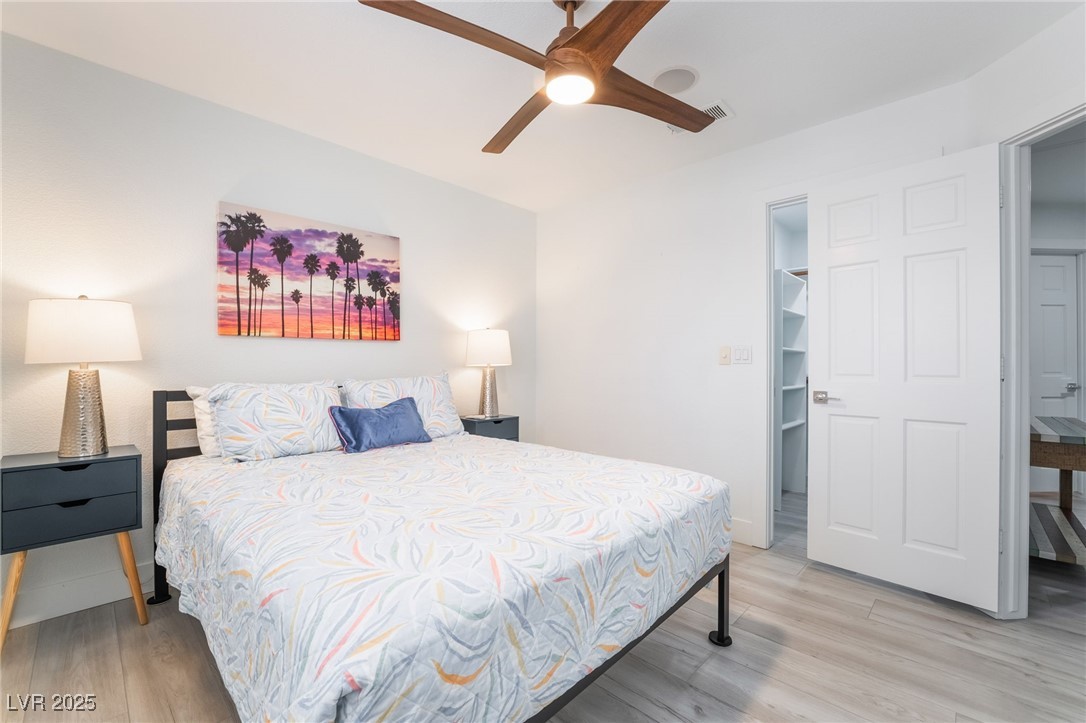 188 Carthage Street Henderson, NV 89074 - Photo 48 of 56 Bedroom with light wood-type flooring and a ceilin