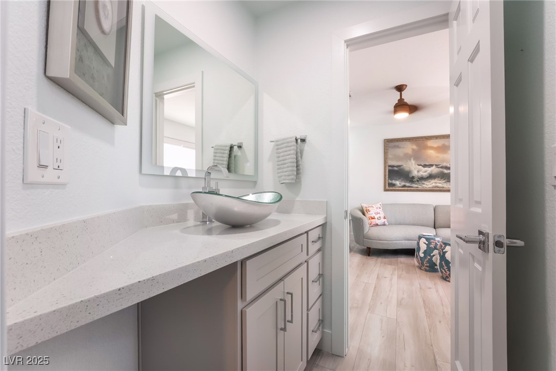 188 Carthage Street Henderson, NV 89074 - Photo 49 of 56 Ensuite bathroom featuring vanity and wood finishe
