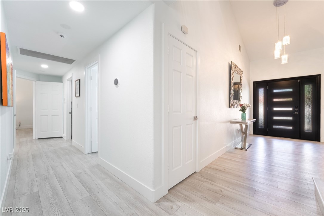 188 Carthage Street Henderson, NV 89074 - Photo 6 of 56 Entrance foyer with light wood-style flooring, bas