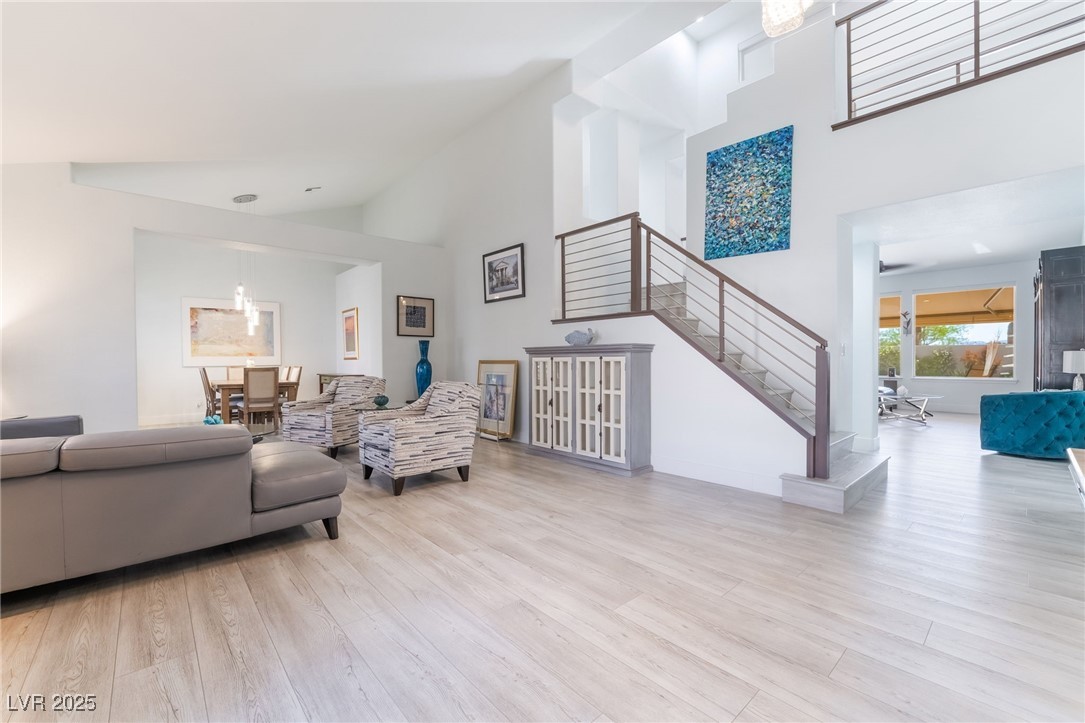 188 Carthage Street Henderson, NV 89074 - Photo 8 of 56 Living area featuring stairway, high vaulted ceili