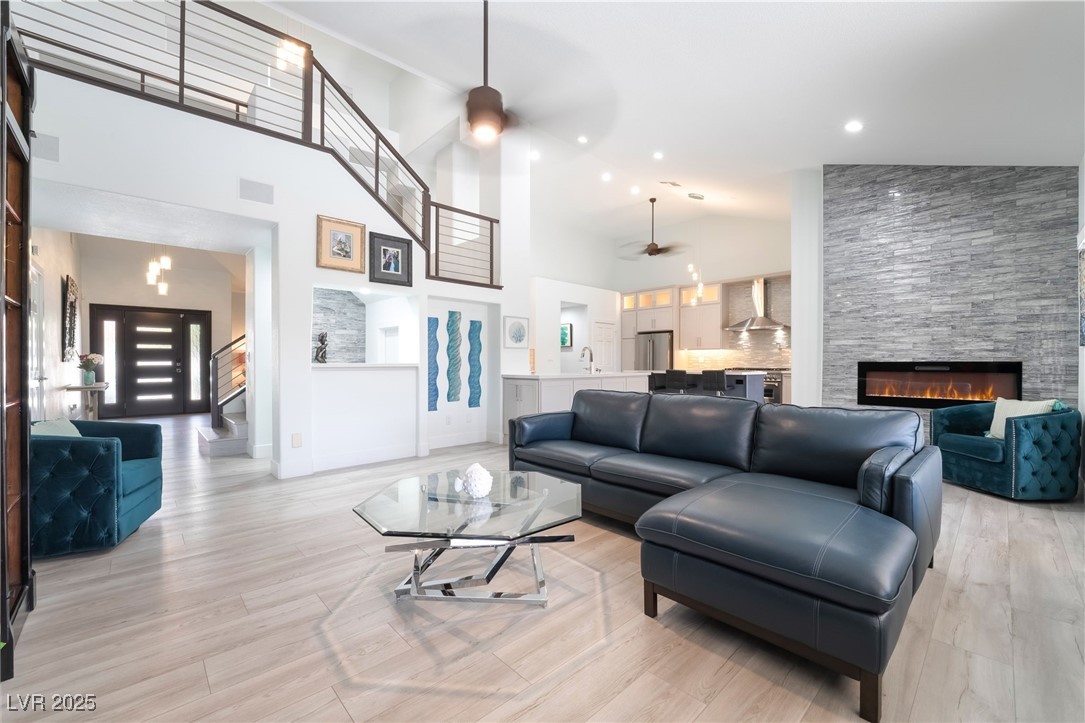 188 Carthage Street Henderson, NV 89074 - Photo 10 of 56 Living area with a ceiling fan, a fireplace, high
