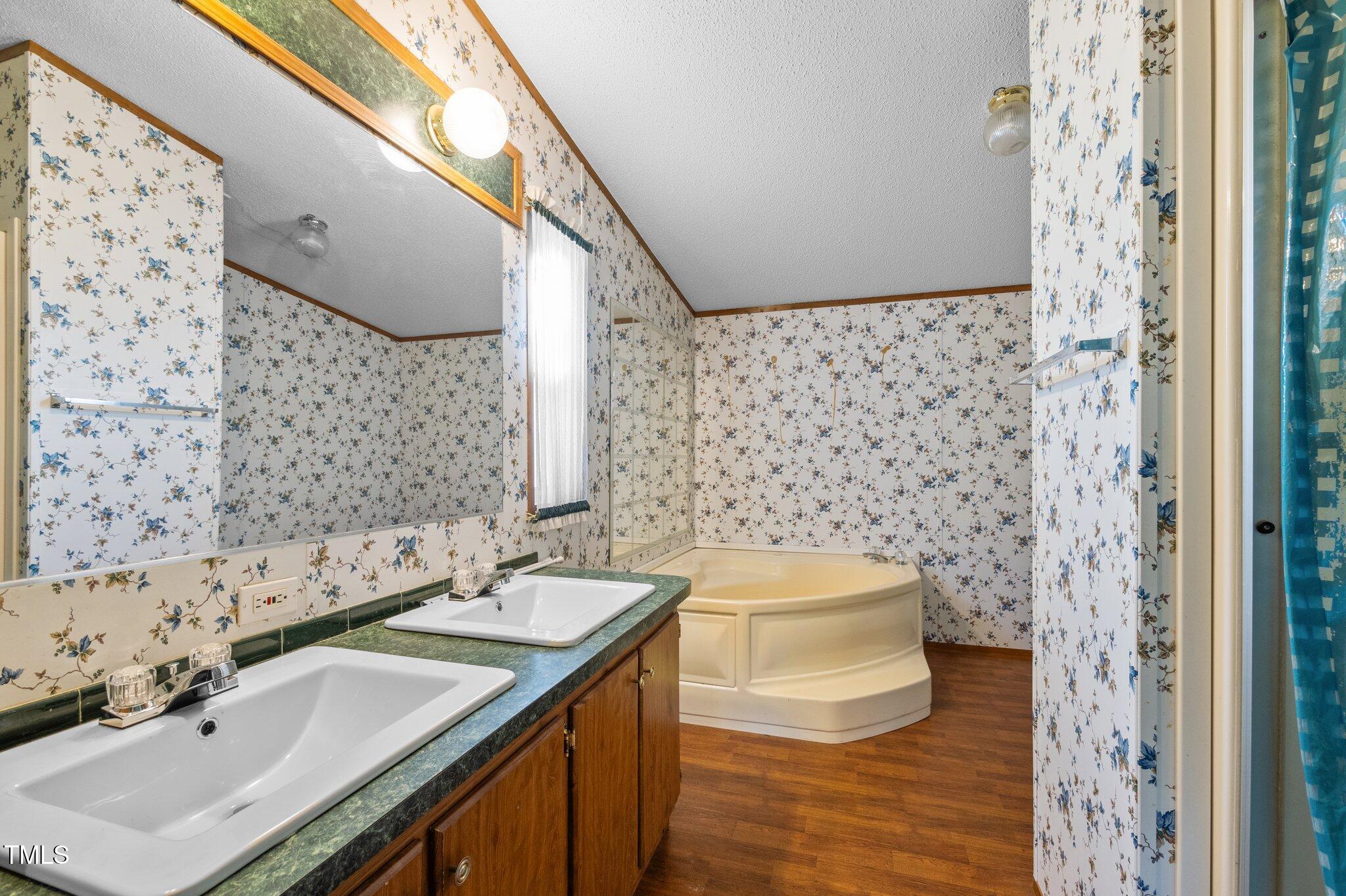 149 Michael Jones Road Roxboro, NC 27574 - Photo 17 of 32 a bathroom with a sink toilet and shower