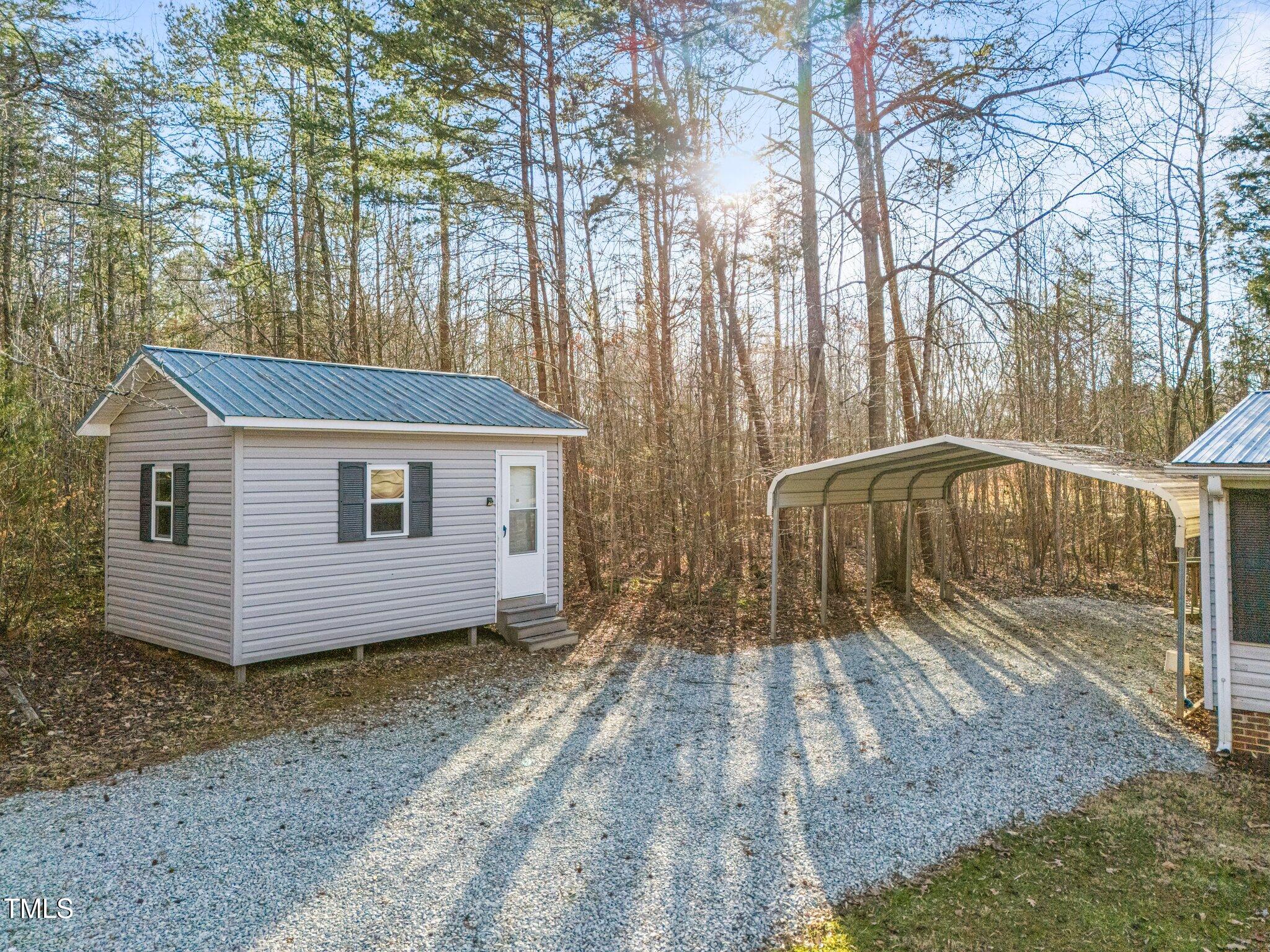 149 Michael Jones Road Roxboro, NC 27574 - Photo 30 of 32 a view of a house with a yard
