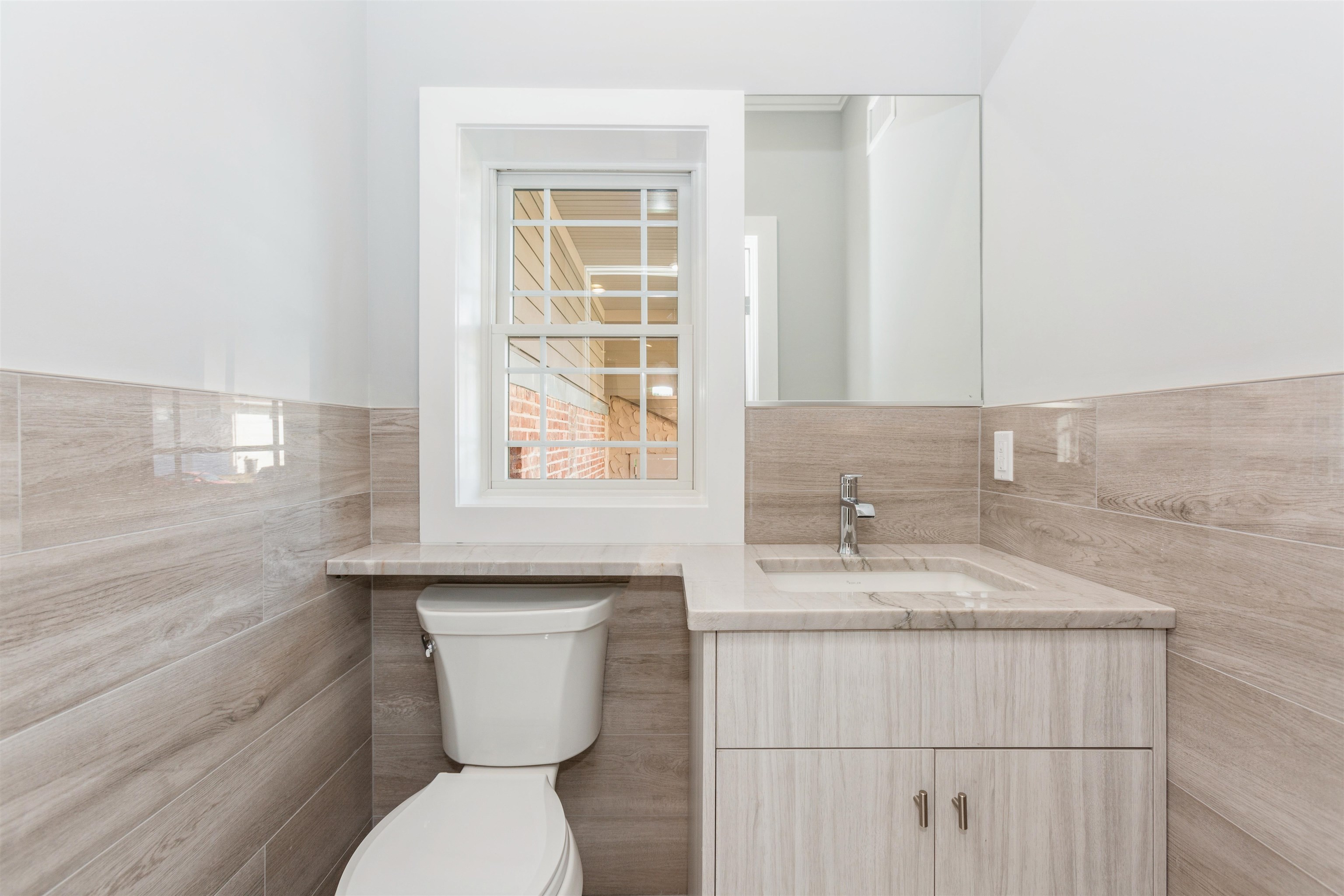 8 Gregory Road Springfield, NJ 07081 - Photo 9 of 30 a bathroom with a granite countertop toilet sink and mirror