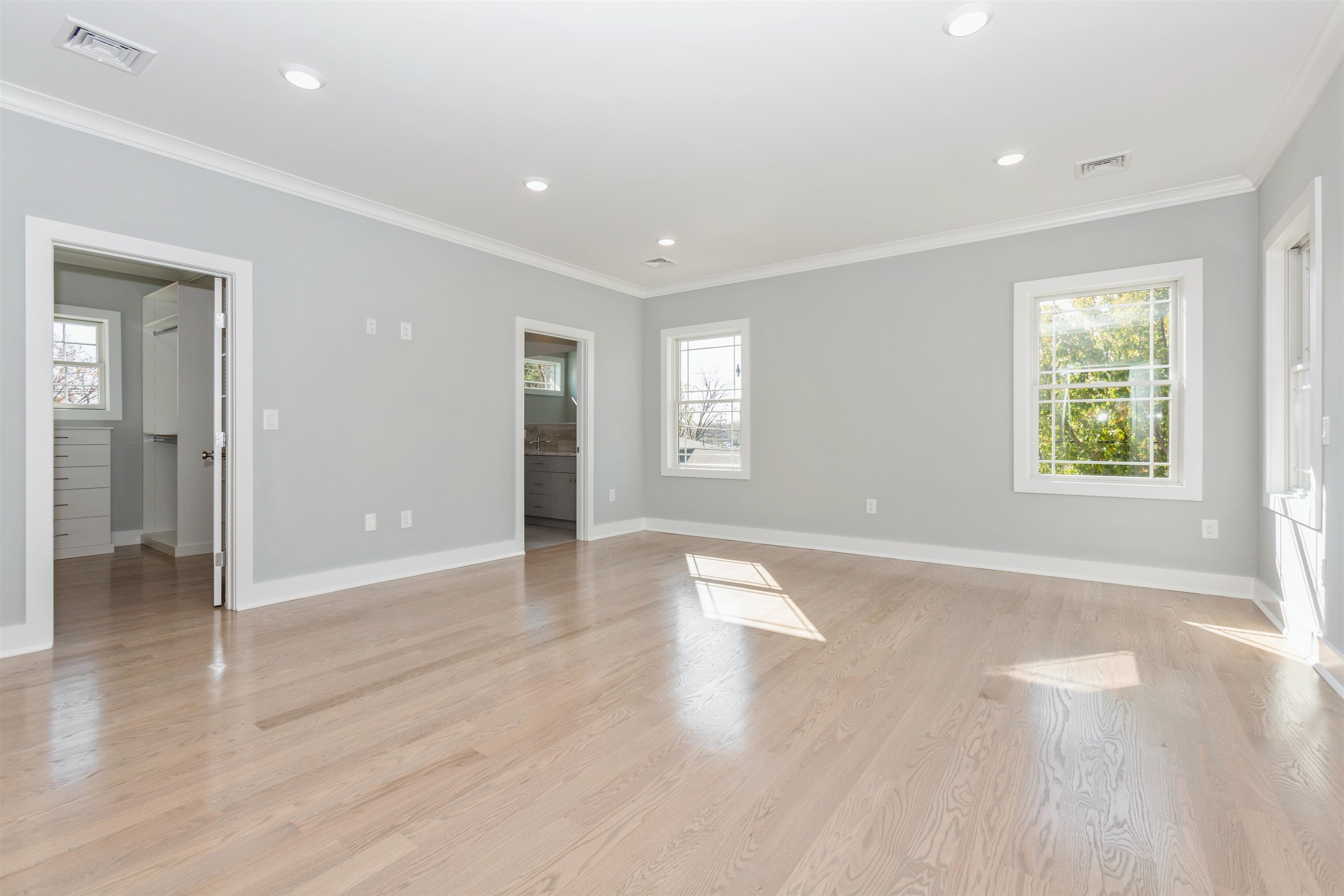 8 Gregory Road Springfield, NJ 07081 - Photo 10 of 30 an empty room with wooden floor and a window