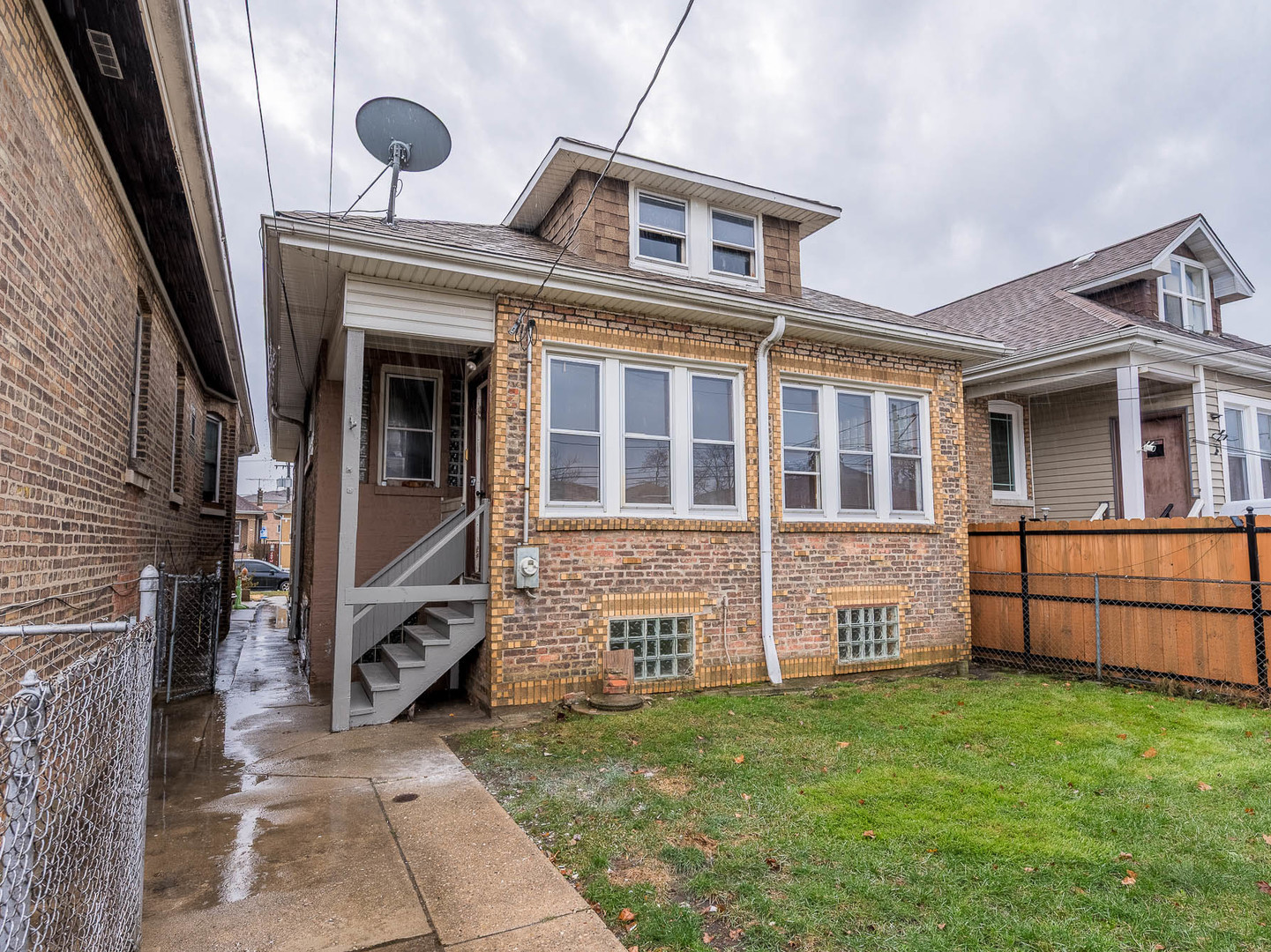 5238 West Wolfram Street Chicago, IL 60641 - Photo 14 of 15 a front view of a house with a garden