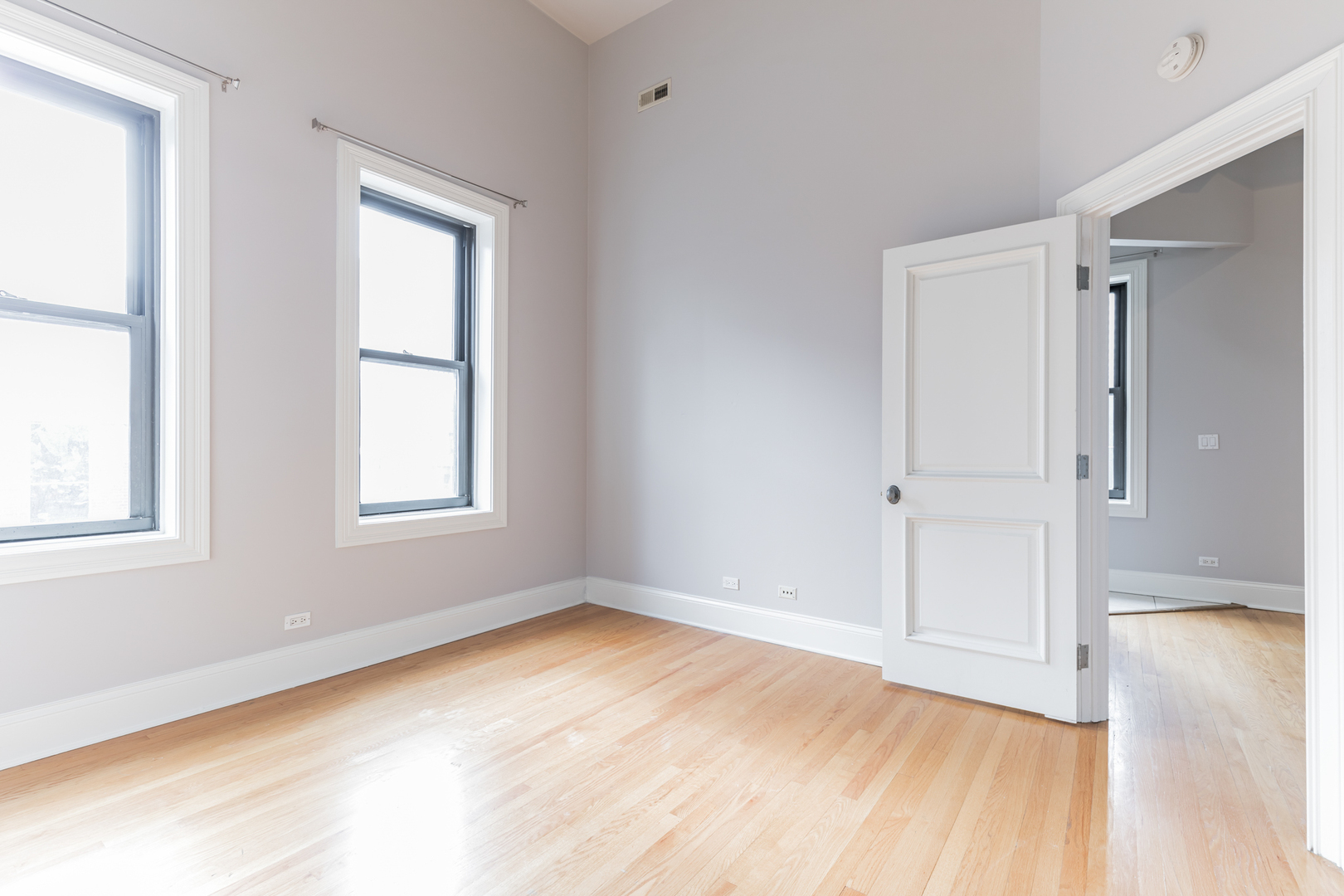 166 West Grand Avenue, Unit 3B Chicago, IL 60654 - Photo 11 of 16 a view of empty room with wooden floor and fan