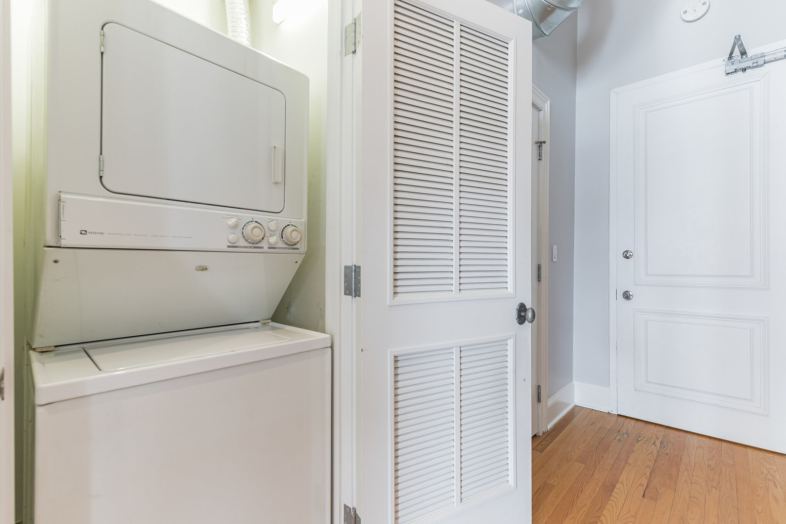 166 West Grand Avenue, Unit 3B Chicago, IL 60654 - Photo 16 of 16 a utility room with dryer and washer