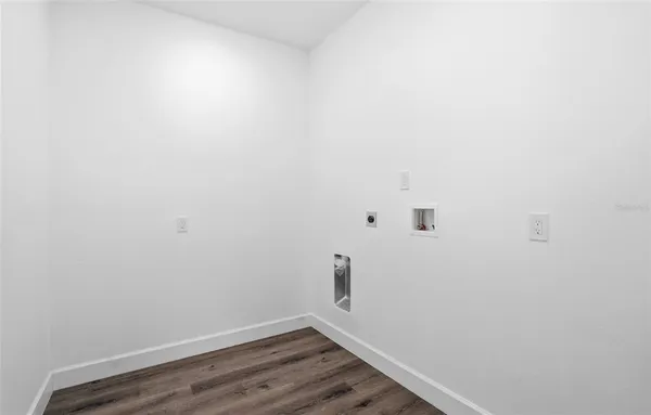 a view of a small space with wooden floor