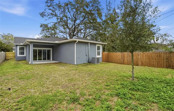 a house with a tree in front of it