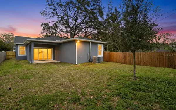 a house with a tree in front of it