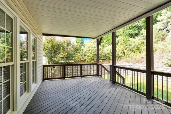 a view of a balcony with wooden floor