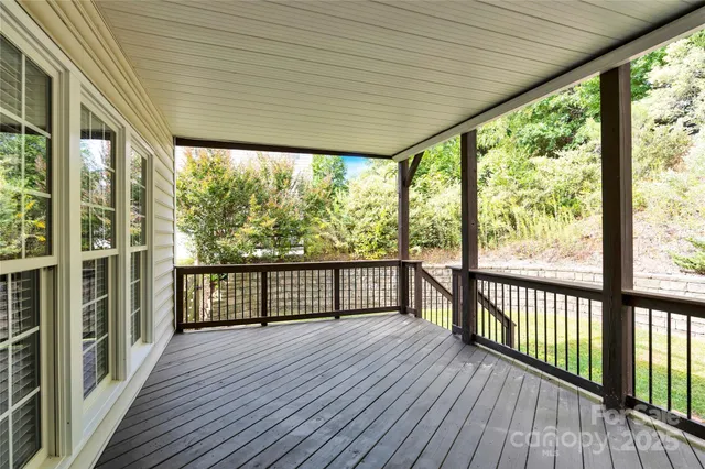 a view of a balcony with wooden floor