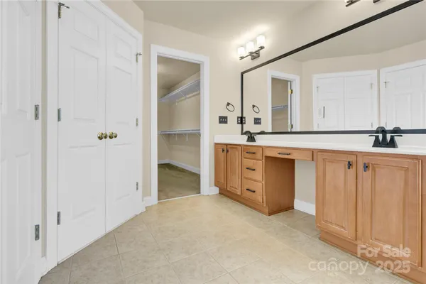 a kitchen with granite countertop a sink and cabinets