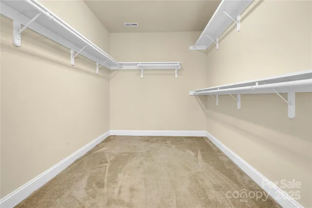 a view of an empty walk in closet