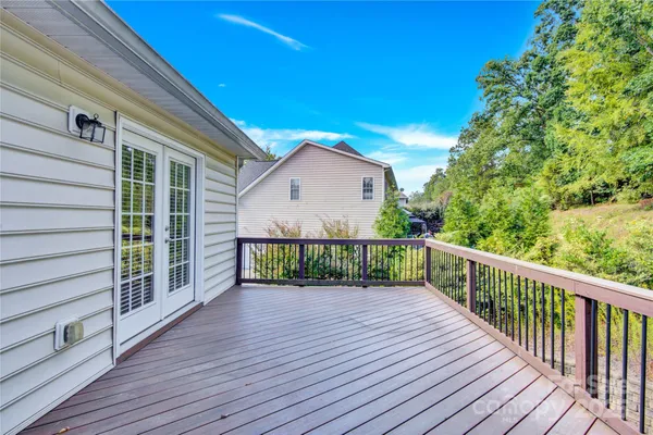 a view of a balcony with wooden floor