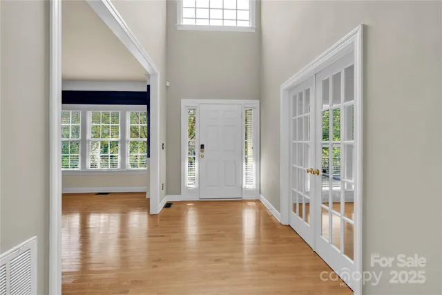 a view of an entryway with wooden floor