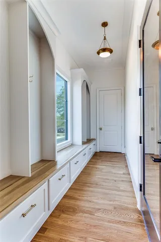 a view of an entryway and kitchen