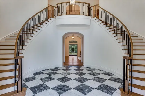 a view of a hallway with a front door